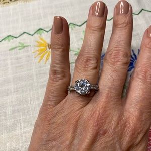 Faux diamond engagement ring. Silver tone eternity band.